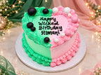 Wicked-themed split heart cake